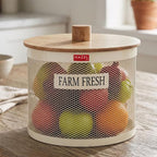 The empty cream mesh vegetable basket shown against a plain white background with its round wooden knob lid leaning