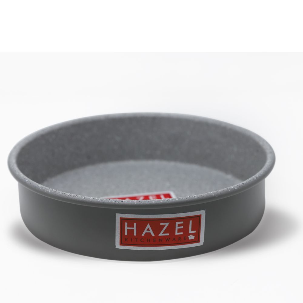 Empty grey non-stick round cake mould shot at a three-quarter angle on a plain white background.