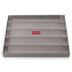 Grey perforated bread tray viewed from above.