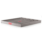 Grey perforated bread tray shown in a kitchen setting.