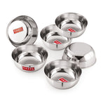 The six empty bowls are arranged in a cluster with one bowl flipped over to show its underside, on white.