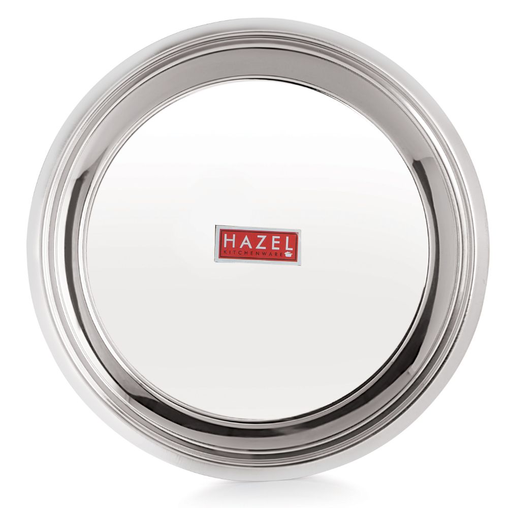 The empty parat shot at a tilted top-down angle showing its interior and reflective rim, on a plain white background.