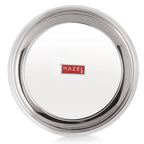 The empty parat shot at a tilted top-down angle showing its interior and reflective rim, on a plain white background.