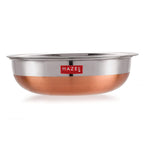 Stainless steel tasla shown in profile, highlighting the copper bottom, plain white background.