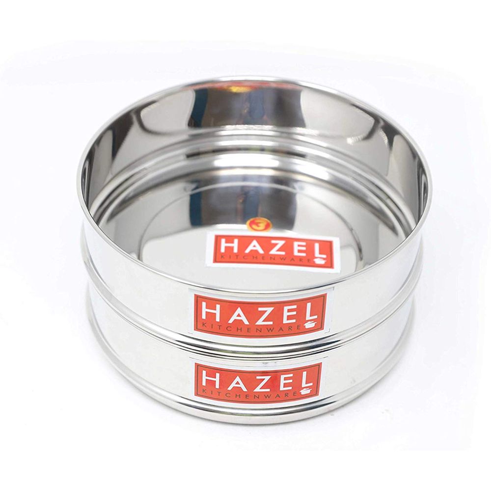 Two closed dabbas are stacked and shown from a front angle on a white background.
