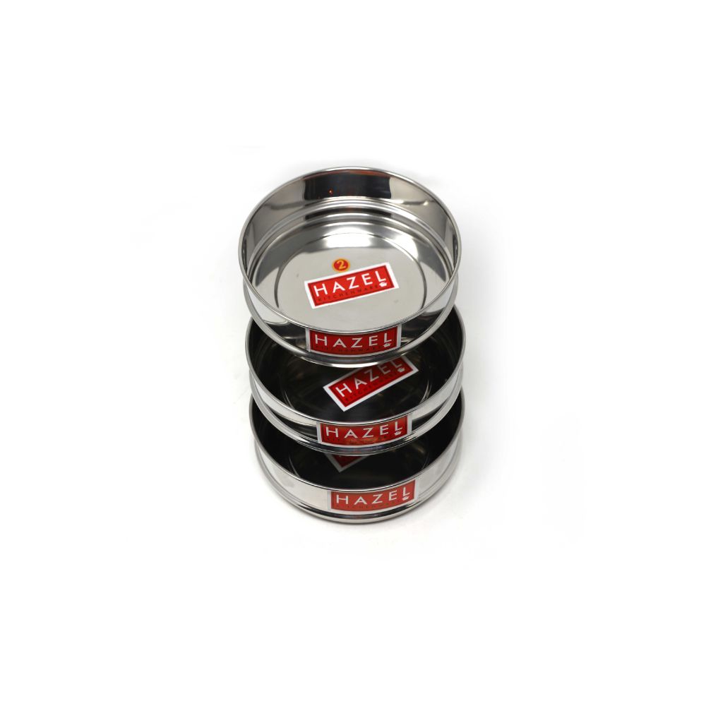 Stacked set of three dabbas on a white background, similar angle to position 2.
