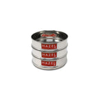 Three stacked dabbas on a white background, straight-on clean angle.