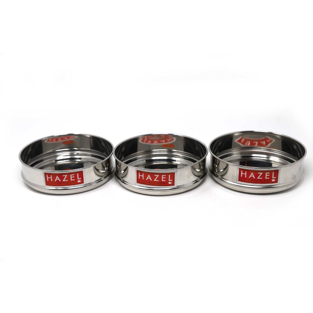 Three dabbas separated and arranged side by side (not stacked), showing individual pieces, on a white background.