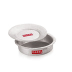 An empty hammered aluminium dekchi with its lid tilted beside it, shown on a white background.