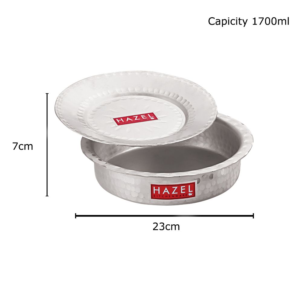 Dimension diagram of the dekchi and lid showing 7 cm height and 23 cm diameter, with a capacity of 1700 ml.