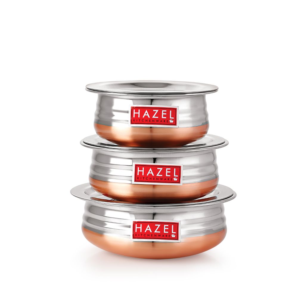 Two copper-bottom urlis with their lids placed separately above them, arranged in a grouping on a white background.