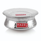 Assembled hammered aluminium handi with lid on, shown at a similar front angle on a white background.