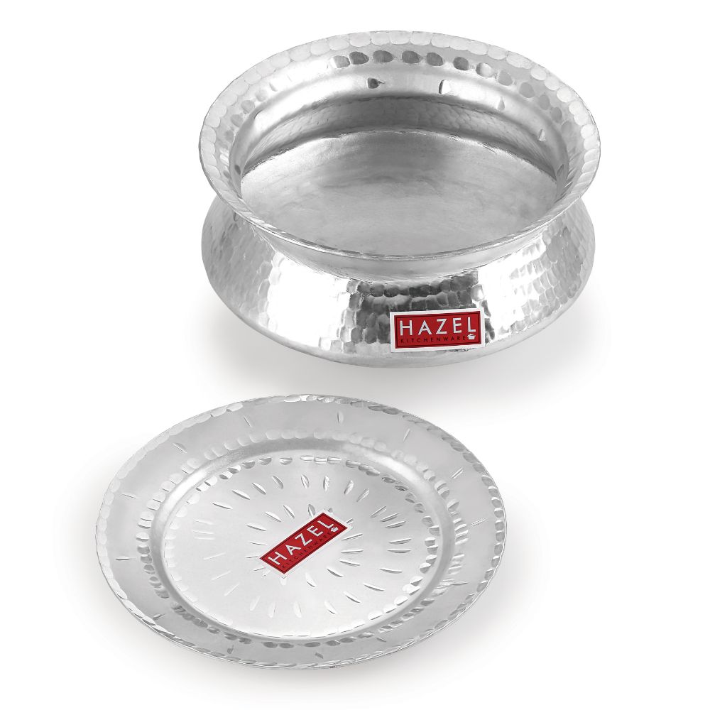 Hammered aluminium handi with its flat lid separated and placed beside it on a white background.