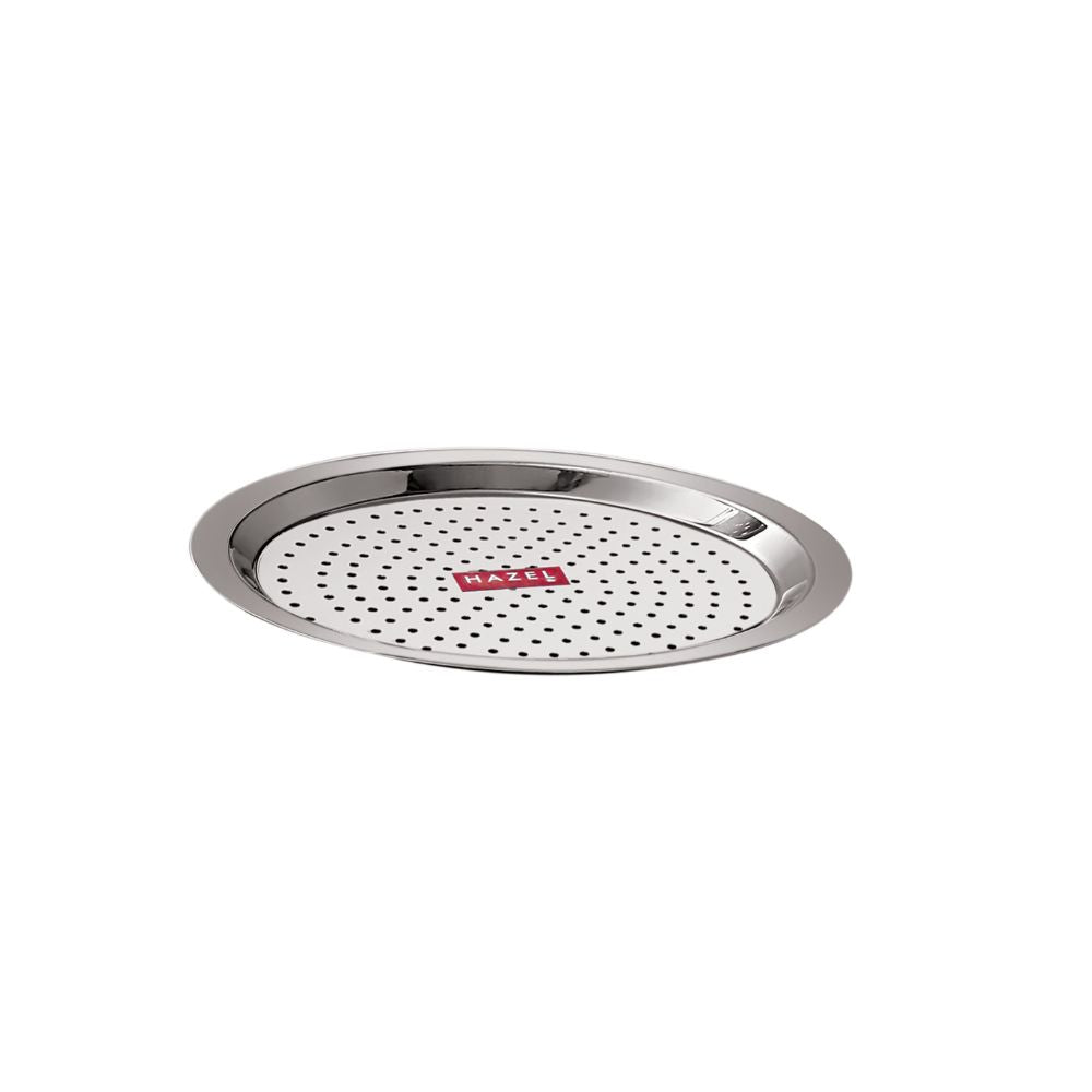 Single empty perforated stainless steel cover lid with holes, shown at a slight angle on a white background.