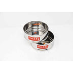 Two empty stainless steel dabbas stacked together, angled view on a plain white background.