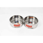 Two empty dabbas shown separated side by side on a plain white background.