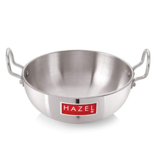 Empty aluminium kadai with two handles, front view on a white background.
