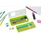 Open pencil box with tray of pencils and erasers, with loose pens, pencils, a marker, and a notebook corner nearby.