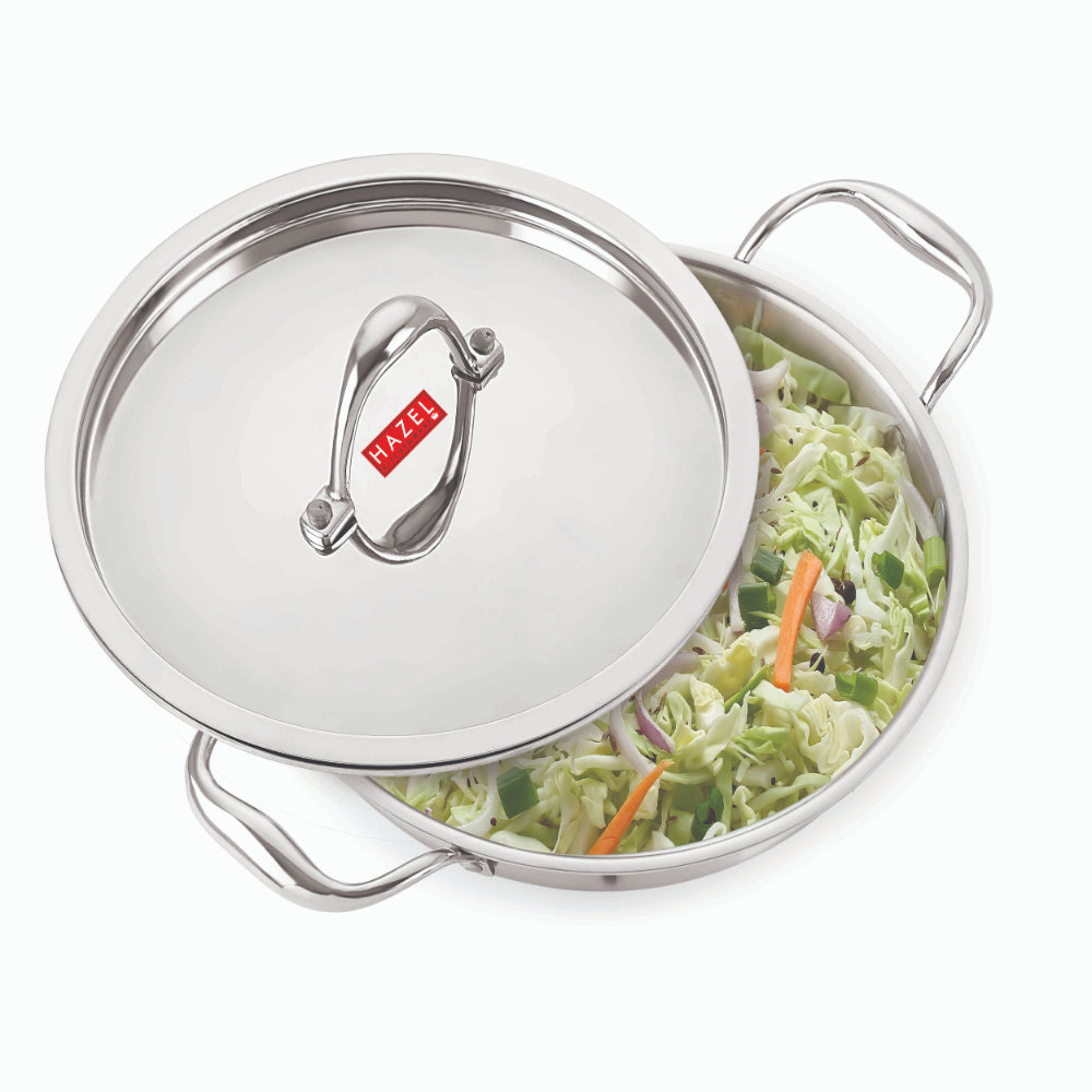 The stainless steel triply kadhai with its steel lid shown on a plain white background.