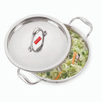 The stainless steel triply kadhai with its steel lid shown on a plain white background.