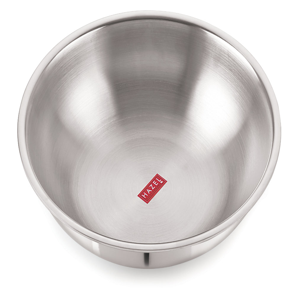 Top-down interior view of a deep triply steel bowl on a white background.