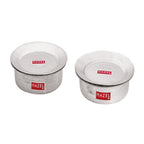 Set of two lidded aluminium hammered patilas of different sizes on a plain white background.