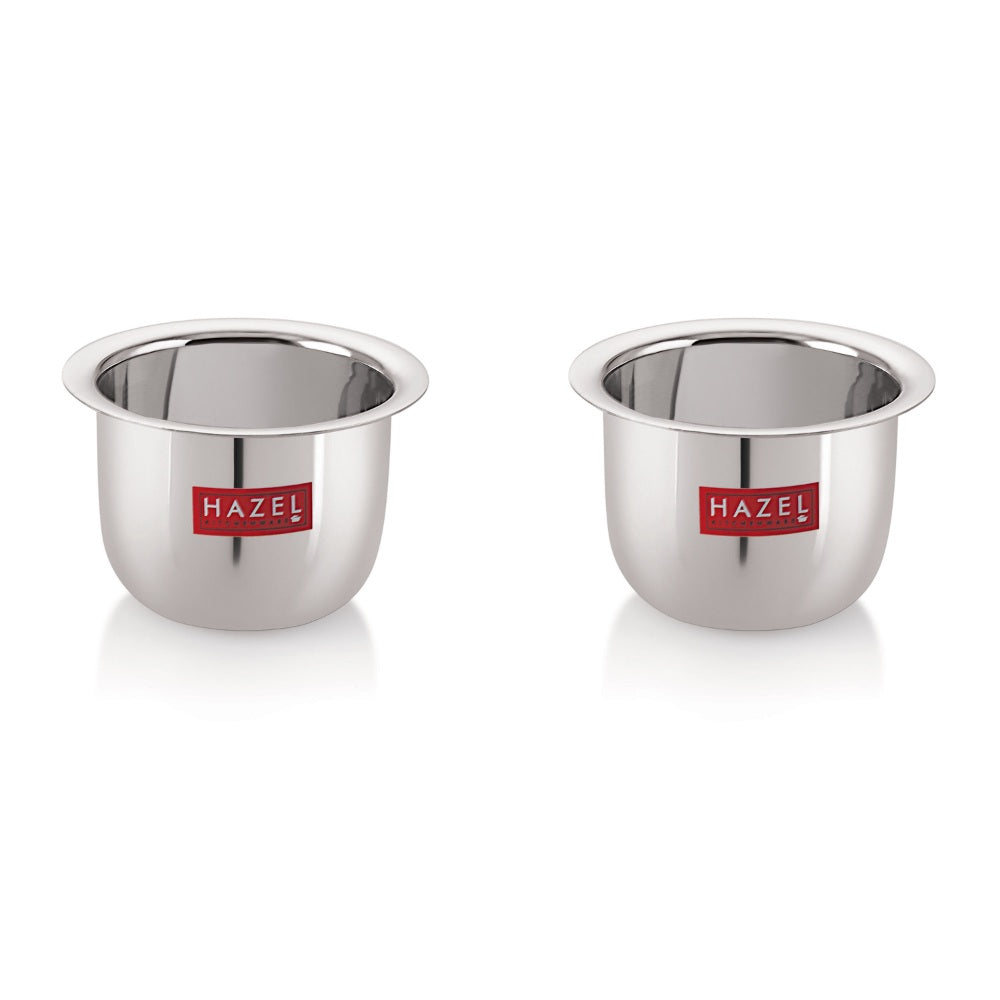 Two small stainless steel tea cups shown side by side on a white background.