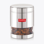 Single steel storage container filled with namkeen visible through the transparent window on a light grey background.