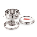 Open stainless steel tiffin box with lid and inner ring separated on a white background.