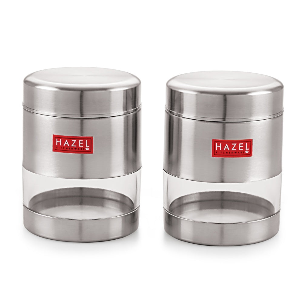 Two empty matte steel containers with clear windows shown side by side on white.