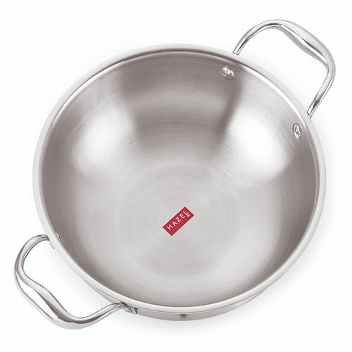 Empty stainless steel triply induction kadai with two riveted steel handles shown on a plain white background.