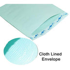 Open pale-green cloth-lined envelope showing inner texture