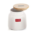 White ceramic storage jar with wooden lid resting ajar on top, shown at a front angle on a plain white background.
