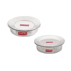 Set of two lidded hammered aluminium patilas arranged on a white background.