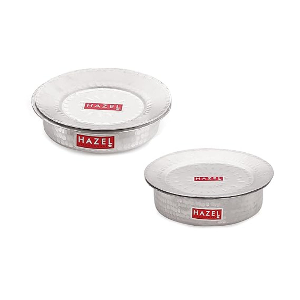 Set of two lidded hammered aluminium patilas arranged on a white background.