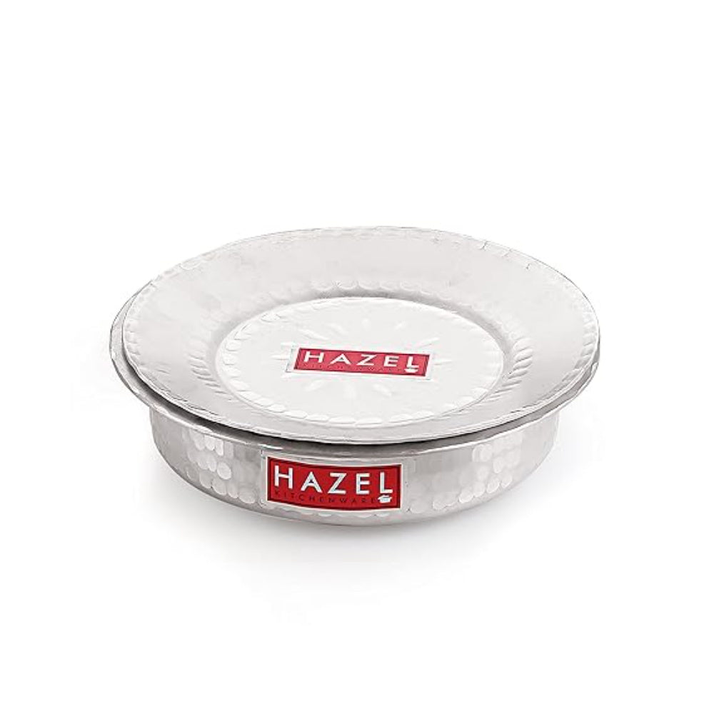 Single lidded hammered aluminium patila shown from the side on white.
