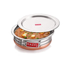 Single medium copper-bottom urli with its lid placed separately beside it, on a white background.