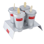 Aluminium kulfi mould set of four cups with sticks in the stand shown from a lower angle on a plain white background.