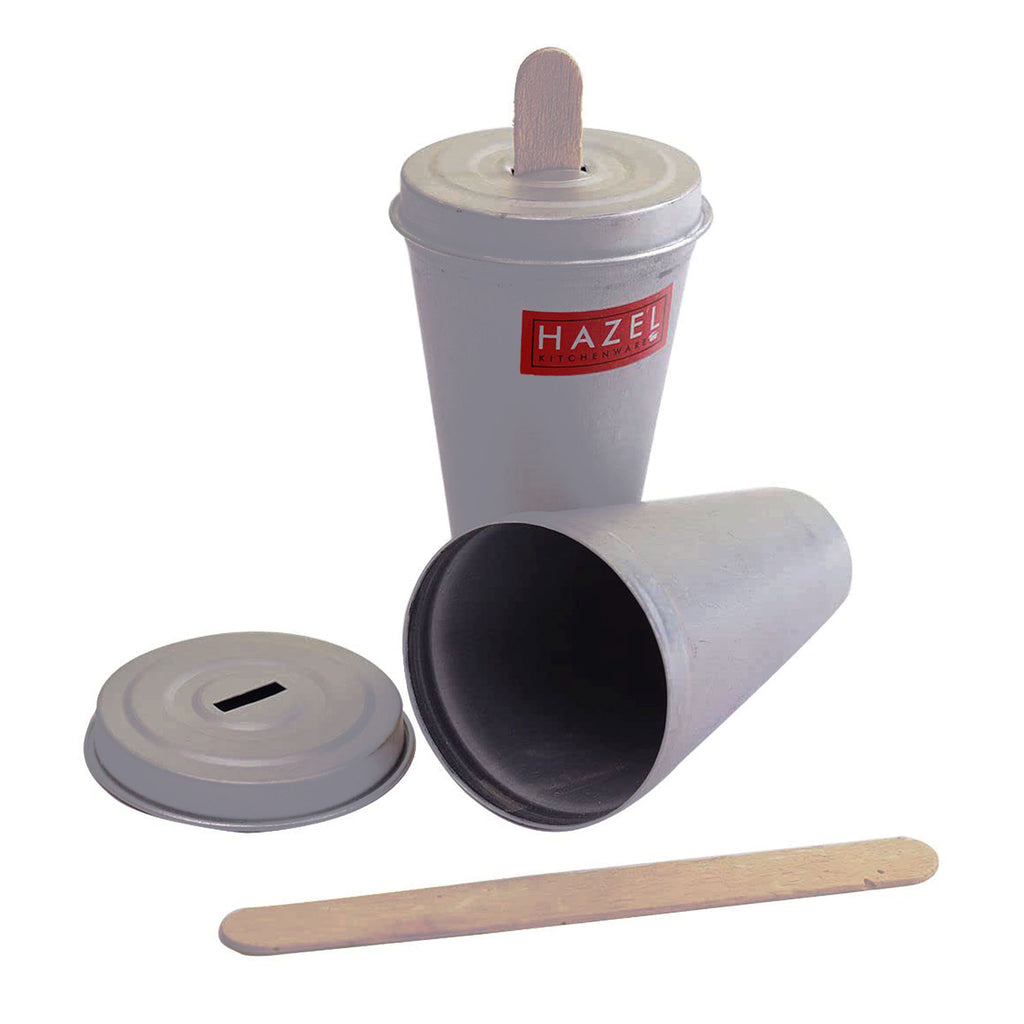 Close-up of a single kulfi mould cup with its lid and a separate ice cream stick and wooden stick shown on a plain.