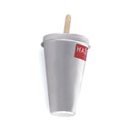 Single aluminium kulfi mould cup with red HAZEL label and an ice cream stick in its lid on a plain white background.