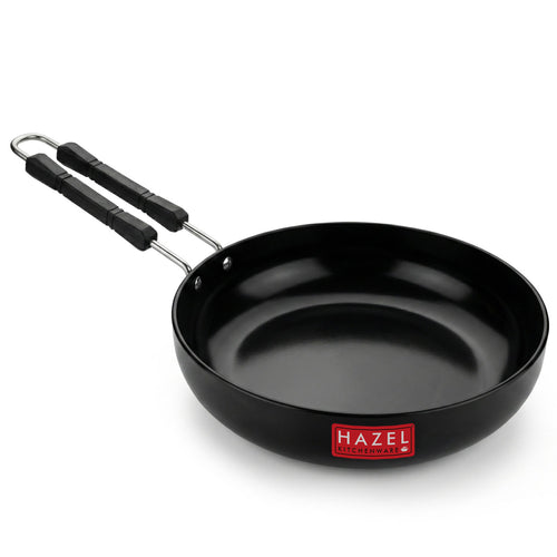 A single black fry pan with a riveted handle, shown alone on a white background.